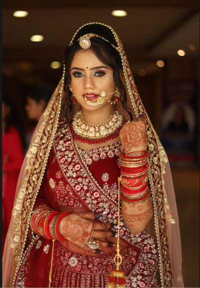 Traditional red bridal makeup created by Manasvi Beauty Saloon